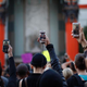 People aim cellphones at a speaker in front of the TCL Chinese Theatre on Hollywood Boulevard in Los Angeles on Dec. 6, 2014, as they march to protest the decision in New York not to indict a police officer involved in the choke hold death of Eric Garner in New York City.
David McNew/Getty Images